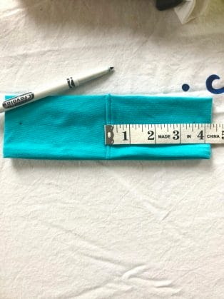Measure out 3.5 inches from the seam of the headband, mark with a marker- this is where your buttons will go